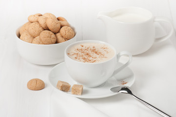 Amaretti Biscuits. Cup Of Cappuccino Coffee. Lump Demerara Sugar