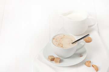 Amaretti Biscuits. Cup Of Cappuccino Coffee. Lump Demerara Sugar