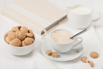 Amaretti Biscuits. Cup Of Cappuccino Coffee. Lump Demerara Sugar