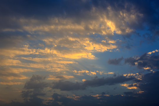 Golden clouds on sunset in sky © Vladimir Liverts