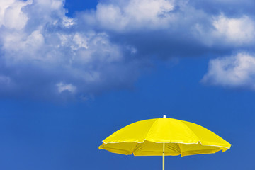 Fototapeta na wymiar Yellow sun umbrella