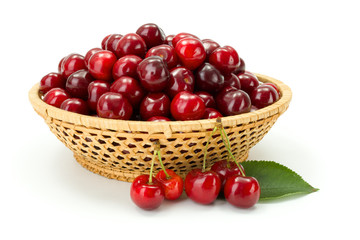 Sweet cherry berries (Prunus avium) in wicker plate