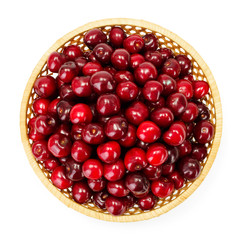 Top view of sweet cherry berries (Prunus avium) in wicker plate
