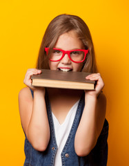 girl in red glasses with books