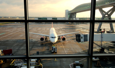 Passenger plane being refuelled in a UK airport.