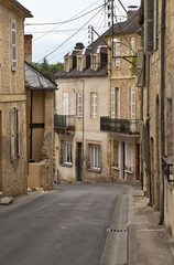 Market Town Street in France. The tightly packed living conditions of an old market town in France has been adapted to modern living.