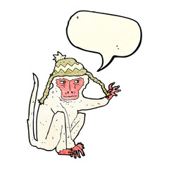 cartoon monkey wearing hat with speech bubble