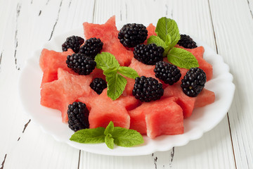 Refreshing watermelon salad with blackberries and mint. Fresh star shaped watermelon