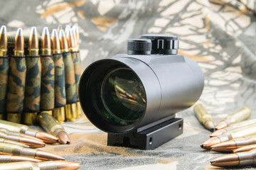 rifle ammunition and red dot sight