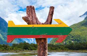 Lithuania Flag wooden sign with mountains background