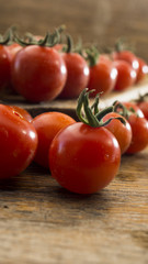 Cherry Tomatoes 015 on wooden chopping board and wooden table.