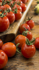 Cherry Tomatoes 016 on wooden chopping board and wooden table.
