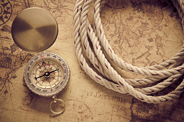 Fototapeta na wymiar Vintage compass on old map