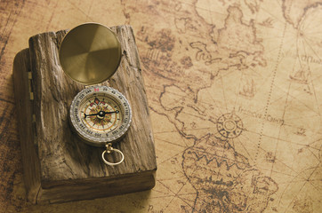 Vintage compass on old map