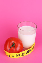 Allergenic food on pink background
