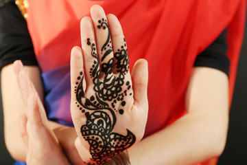Image of henna on female hand, closeup