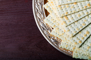 Matzo for Passover on metal tray on table close up