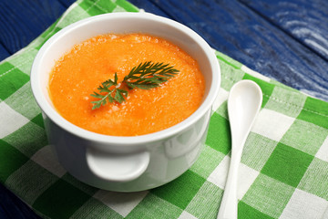 Carrot cream-soup on table close up
