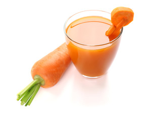 Glass of carrot juice with vegetable slices with vegetables isolated on white