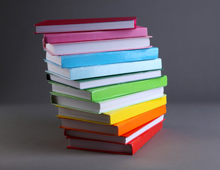 Colorful books on gray background