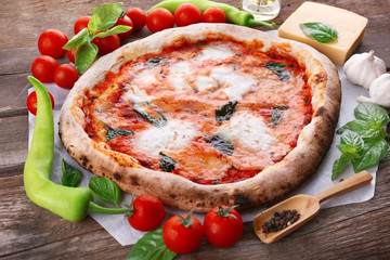 Delicious pizza on wooden table, closeup