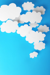 White paper clouds on blue background. Cloud computing concept.