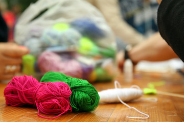 Yarn for knitted beautiful mandala on table close up