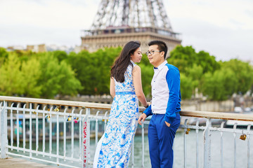 Young romantic Asian couple in Paris, France