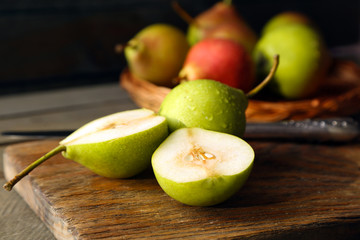 Ripe tasty pears on table close up
