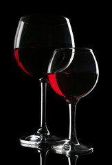 Fototapeta na wymiar Glasses of wine isolated on black
