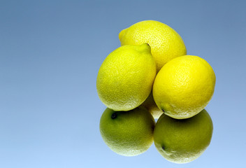 lemon on a blue background, mirror
