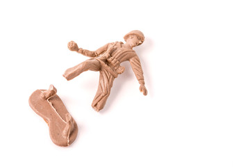 Broken Plastic Toy Soldiers on white background