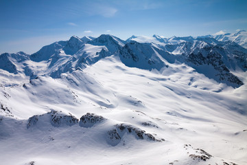 Winter snow covered mountain peaks in Austrian alps