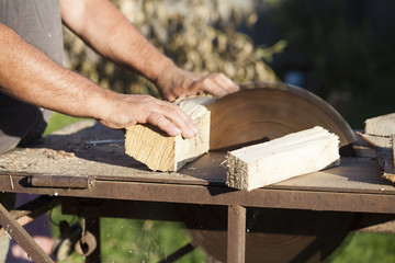 Lumberman working on circular saw
