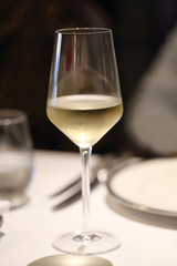 glass of chilled white wine on table