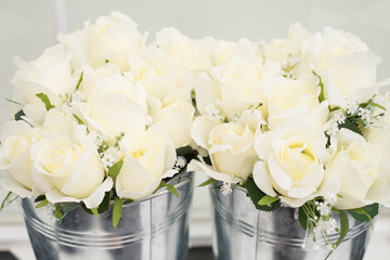 White rose fake flowers in pots