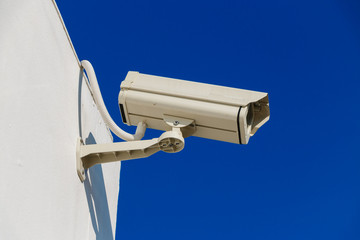CCTV on building with blue-sky background