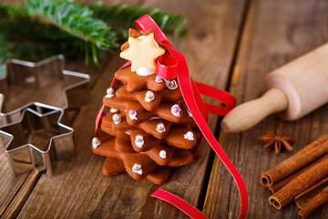 Homemade baked Christmas gingerbread tree on vintage wooden back