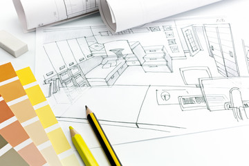 architects desk on a white background with living room picture, paper rolls and drawing materials