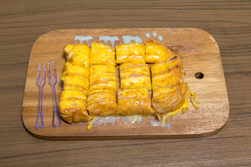 french toast with butter and milk wood back ground