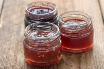 Small jam jar on wood table