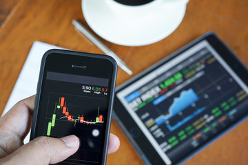 Business man hand hold and touch screen on smart phone,tablet,ce