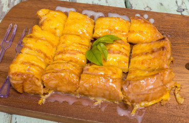 french toast with butter and milk wood back ground