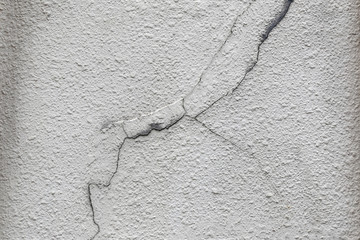Cracked cement wall.