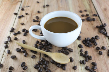 White coffee cup and roasted coffee beans.