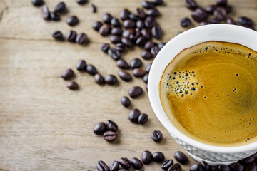 white coffee cup  with coffee beans