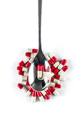 Capsules over silver spoon, Healthcare and Medicine