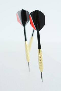 Dart arrows on white background suggesting business vision and strategy concept