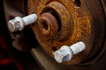 rusty brake disk and detail of the wheel hub,auto repair concept