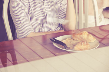 Obraz na płótnie Canvas breakfast,Young businessman sititng in a cafe
